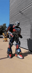 Transformers costumed performers entertain children in Russian town event
