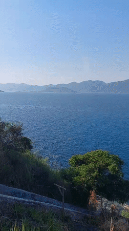 Sunny morning at Nha Trang's graffiti-staired rocky coastline