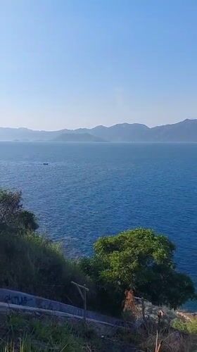 Sunny morning at Nha Trang's graffiti-staired rocky coastline