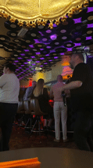 Vinyl record-lined bar in Riga, evening crowd at the counter