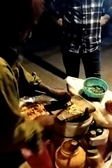 Street vendor prepares traditional food in Dhaka