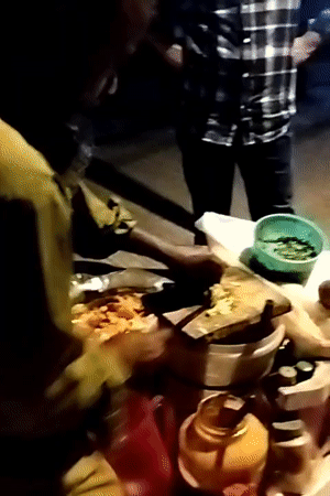 Street vendor prepares traditional food in Dhaka