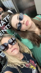 Two women take elevator selfie in Bangkok