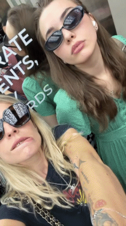 Two women take elevator selfie in Bangkok