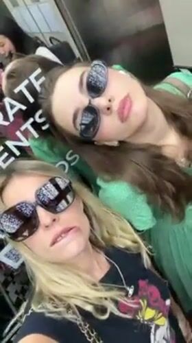 Two women take elevator selfie in Bangkok