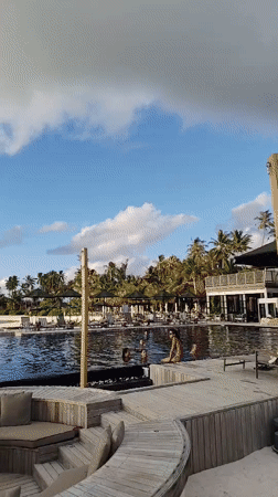 Poolside lounging and fire juggling at a Maldives resort