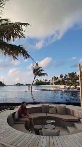 Poolside lounging and fire juggling at a Maldives resort