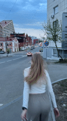 Young woman observed on Perm sidewalk