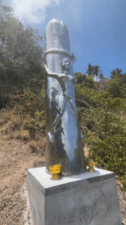 Reflective metallic humanoid sculpture spotted in Thai village