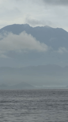 Fishing boat navigates calm waters near Nusa Penida