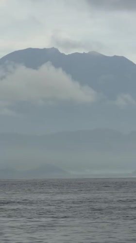 Fishing boat navigates calm waters near Nusa Penida