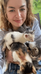 Woman photographed with kittens in Danilovgrad, Montenegro