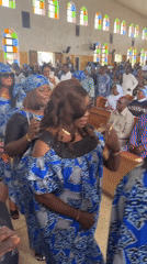 Church procession in Vom, Nigeria, group in matching blue and white