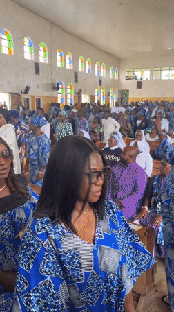 Church procession in Vom, Nigeria, group in matching blue and white