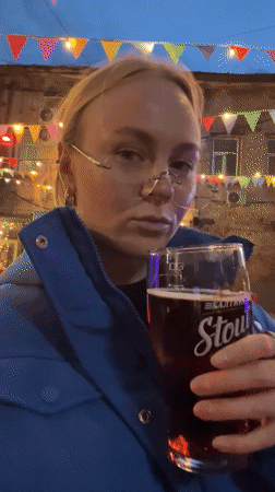 Two women dine outdoors at Vologda restaurant evening