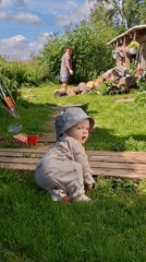 Summer day at a Russian rural homestead: kids, animals, and firewood