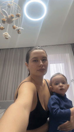 Woman documented during routine activities with child in Odintsovo
