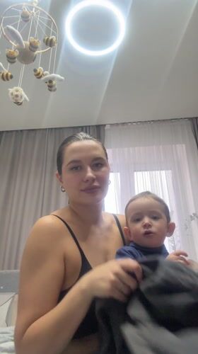 Woman documented during routine activities with child in Odintsovo