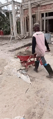 Manual sand-mixing and construction work in Margo Rukun, Indonesia