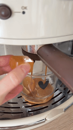 Espresso machine serves coffee over ice cubes in Montenegro