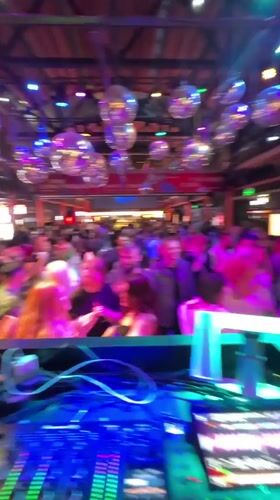 DJ set in full swing at a packed Moscow nightclub