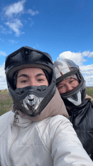 Two women ride ATV in Russian countryside