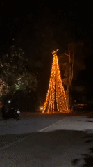 Thailand nighttime scenes show Christmas lights, bar activity, traffic