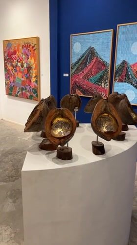 Woman visits art gallery showcasing Balinese paintings in Ubud