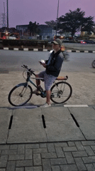 South Jakarta sidewalk life at dusk, vendors and commuters in motion