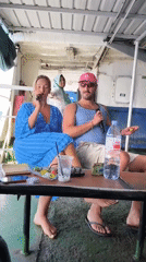 Duo performs musical set on boat deck in Indonesia