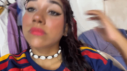 Playful selfie session in Porlamar, shell necklace and soccer jersey