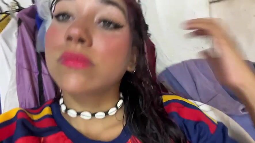 Playful selfie session in Porlamar, shell necklace and soccer jersey