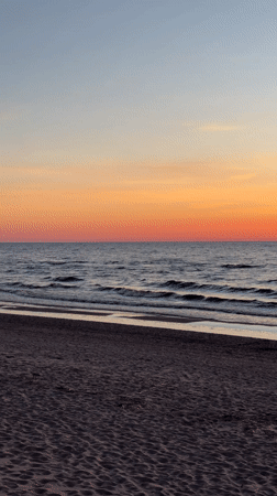 Sunset observed at Riga beach with colorful sky gradient