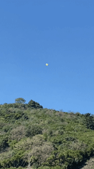 Yellow balloon spotted over Budva hills, torn paper bag documented