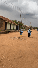 Children play on dirt roads in Nigerian village