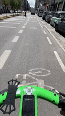 Electric scooter rider documents Milan bike lane journey
