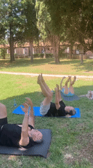 Outdoor yoga session in a Budva park on a sunny morning