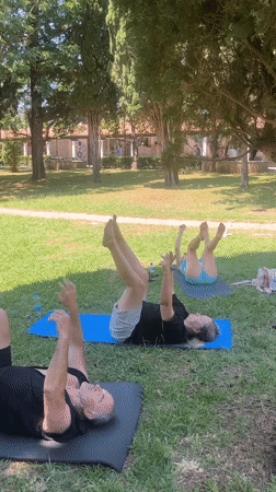 Outdoor yoga session in a Budva park on a sunny morning