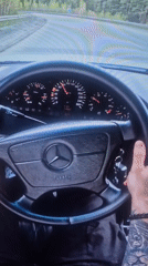 Driver captures nighttime city views from Mercedes vehicle