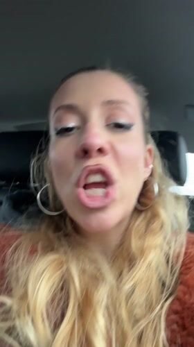 Woman sings rap music while driving in Romford
