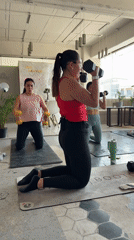 Group fitness class conducts workout session at Puebla studio
