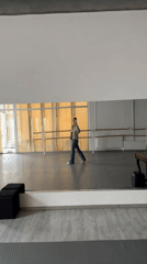 Woman Takes Selfies in Bright Room During Morning Hours