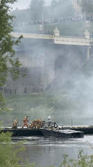 Rescue boat and military personnel conduct river operations in Hrodna
