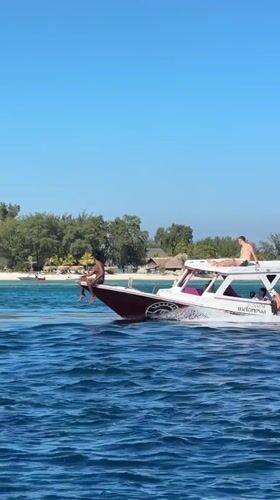 Motorboat cruising tropical Indonesian waters on a clear day