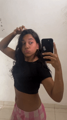 Woman takes selfie in Pampatar, Venezuela early morning