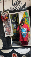 Visitor documents colorful Rastafarian murals at Lekki art space