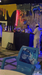 Outdoor bar scene captured at night in Jos, Nigeria