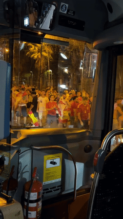 Barcelona streets packed with flag-waving crowds at night