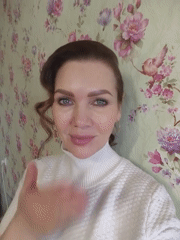 Woman in white sweater photographed indoors during morning session