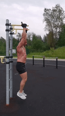 Street workout session at an outdoor fitness station in Kizel